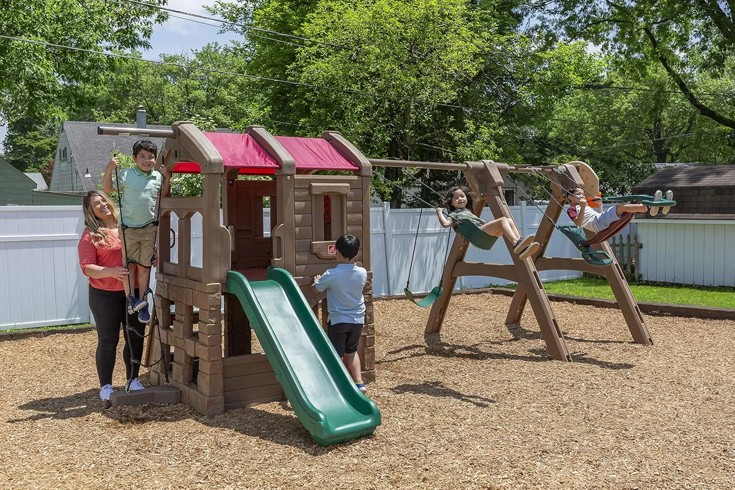 Step2 Naturally Playful Adventure Lodge Play Center with Glider, Kids Outdoor Playset, Two Tier Backyard Playground Set, Slide, Swings, Rope Ladder, Basketball Hoop, Jungle Gym, Children 3-8 Years Old